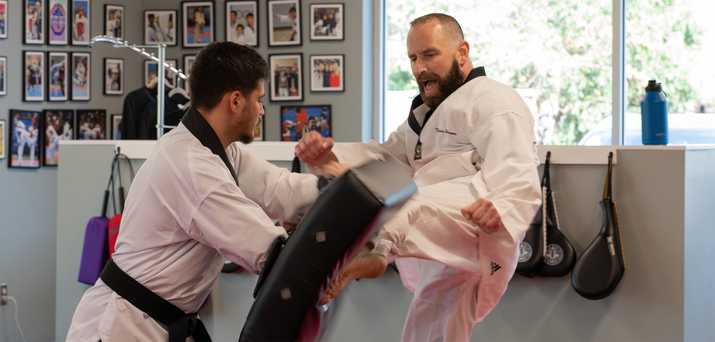 Instructor Matt performing a powerful roundhouse kick