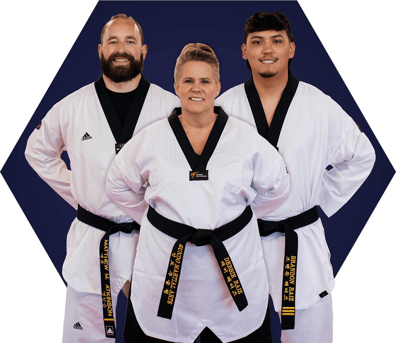 Three adult taekwondo students