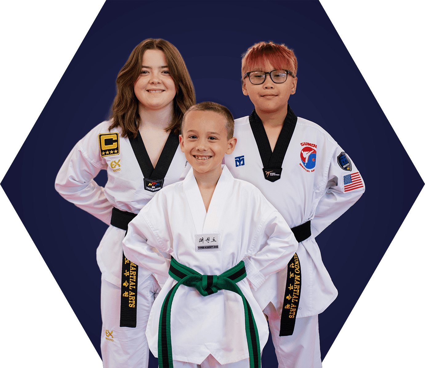 Three kid taekwondo students